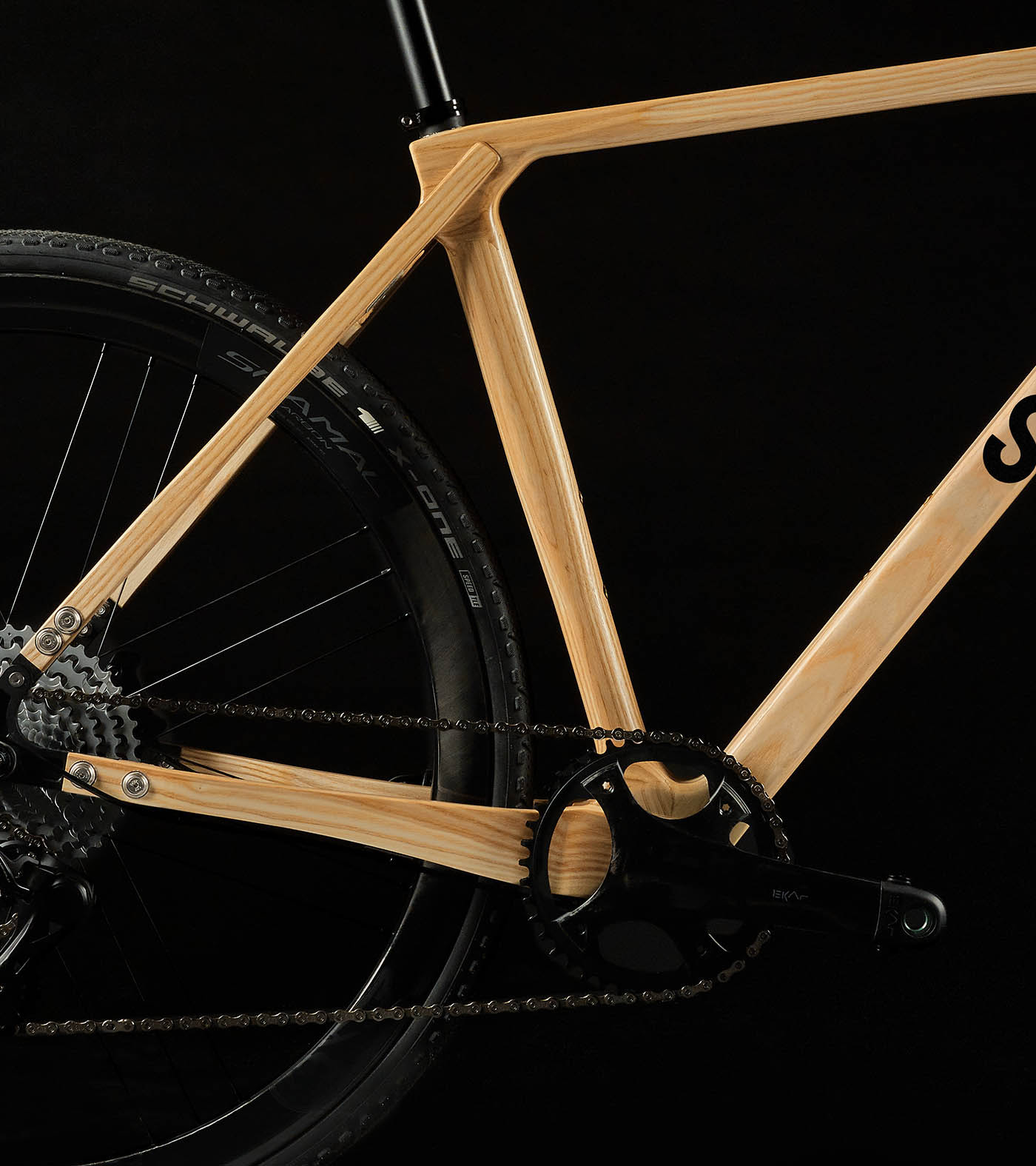 Close up of the frame and pedals of the SILA gravel wooden bike